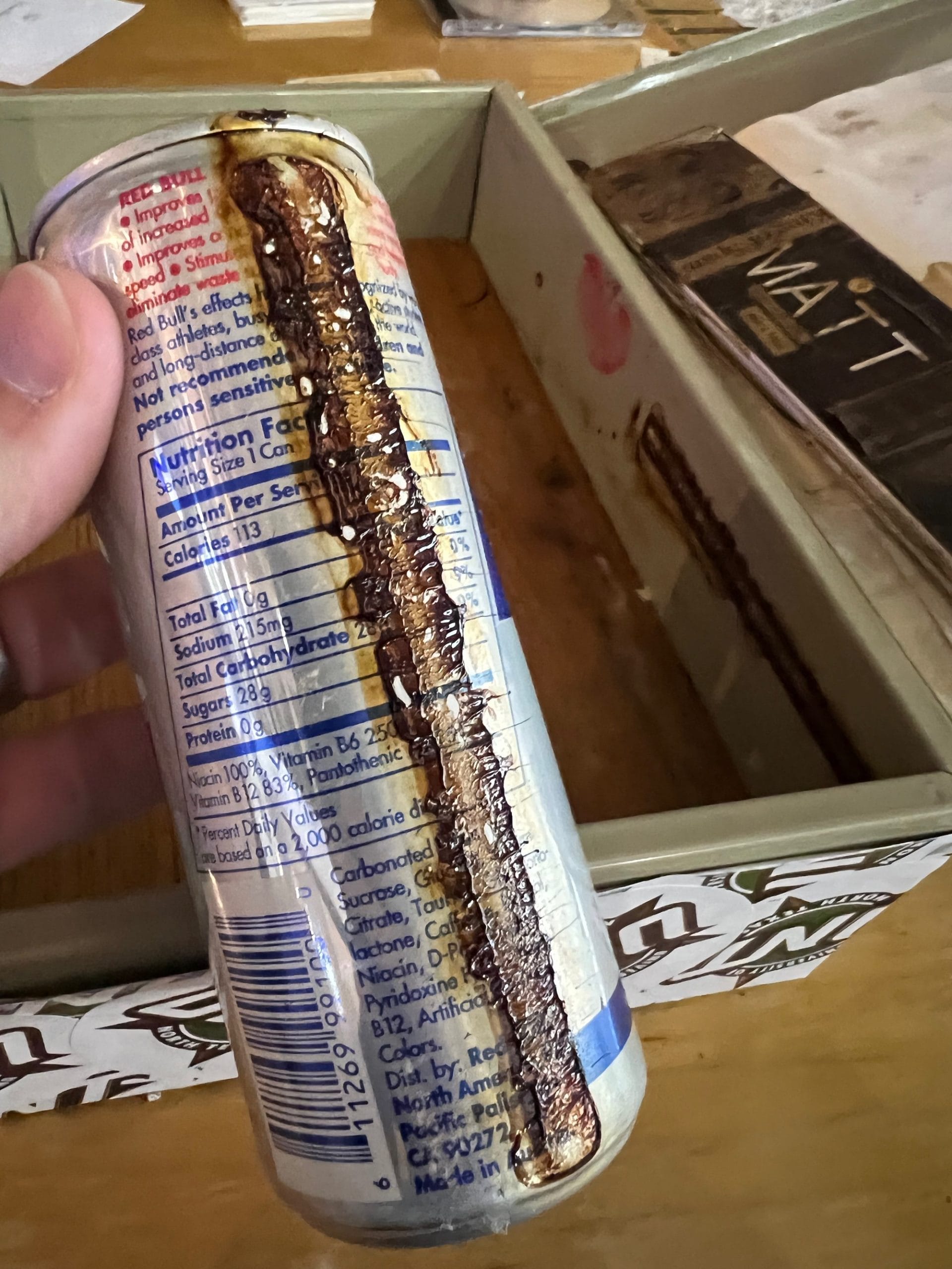 Can of Red Bull energy drink, encrusted with decades-old sugar.