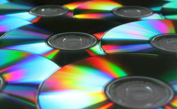 Close-up of compact discs which shows their rainbow shine.