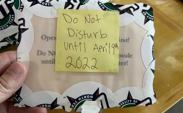 Vellum envelope obscured with a post-it note that reads "Do not disturb until April 9th 2022"